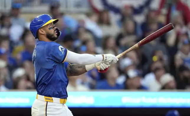 Minnesota Twins' Carlos Correa (4) watches his solo home run during the second inning of a baseball game against the Kansas City Royals, Friday, May 23, 2025, in Minneapolis. (AP Photo/Abbie Parr)