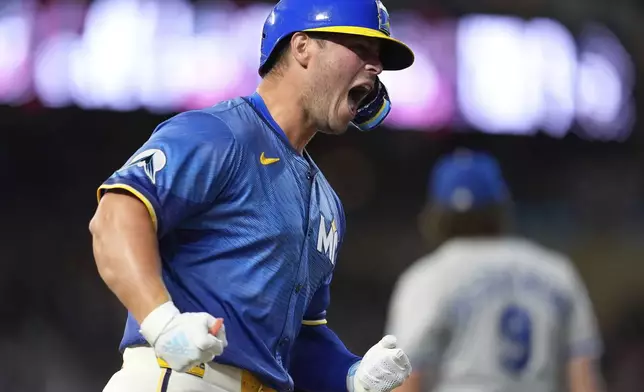 Minnesota Twins' Ty France celebrates after hitting a walkoff two-run home run during the ninth inning of a baseball game against the Kansas City Royals, Friday, May 23, 2025, in Minneapolis. (AP Photo/Abbie Parr)