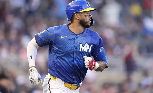 Minnesota Twins' Carlos Correa (4) runs the bases after hitting a solo home run during the second inning of a baseball game against the Kansas City Royals, Friday, May 23, 2025, in Minneapolis. (AP Photo/Abbie Parr)