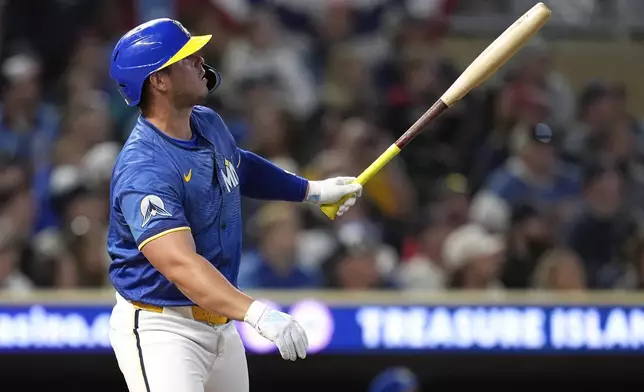 Minnesota Twins' Ty France watches his walkoff two-run home run during ninth inning of a baseball game against the Kansas City Royals, Friday, May 23, 2025, in Minneapolis. (AP Photo/Abbie Parr)