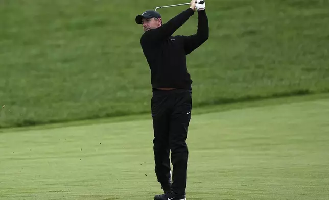 Rory McIlroy, of Northern Ireland, hits on the 13th hole during the second round of the Truist Championship golf tournament at the Philadelphia Cricket Club, Friday, May 9, 2025, in Flourtown. (AP Photo/Matt Rourke)