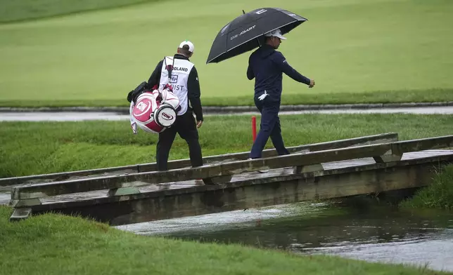 Gary Woodland walks on the 13th hole during the second round of the Truist Championship golf tournament at the Philadelphia Cricket Club, Friday, May 9, 2025, in Flourtown. (AP Photo/Matt Rourke)