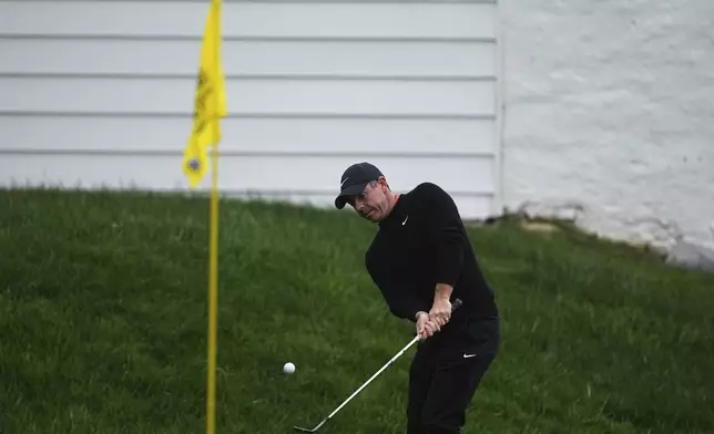 Rory McIlroy, of Northern Ireland, hits on the 13th hole during the second round of the Truist Championship golf tournament at the Philadelphia Cricket Club, Friday, May 9, 2025, in Flourtown. (AP Photo/Matt Rourke)