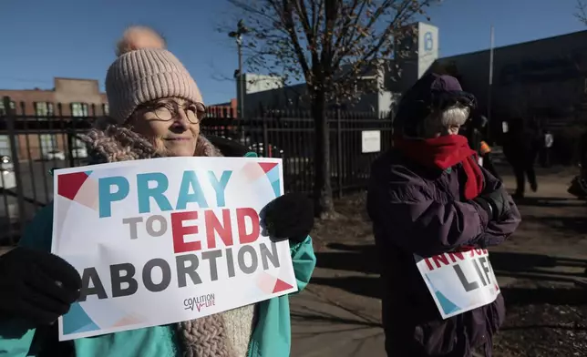 FILE - Anti-abortion protesters Jean Bullock, left, and Sue Dunn, demonstrate outside Planned Parenthood Great Rivers, Dec. 5, 2024, at in St. Louis, Mo. (Laurie Skrivan/St. Louis Post-Dispatch via AP, File)