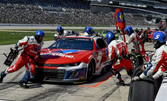 Kyle Larson (5) stops in pit lane during a NASCAR Cup Series auto race at Texas Motor Speedway in Fort Worth, Texas, Sunday, May 4, 2025. (AP Photo/Randy Holt)