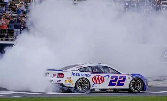 Joey Logano celebrates after winning a NASCAR Cup Series auto race at Texas Motor Speedway in Fort Worth, Texas, Sunday, May 4, 2025. (AP Photo/Larry Papke)