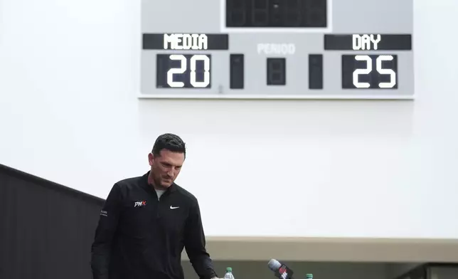 Phoenix Mercury head coach Nate Tibbetts arrives for a news conference during Mercury Media Day at the team's WNBA basketball training facility, Wednesday, April 30, 2025, in Phoenix. (AP Photo/Ross D. Franklin)