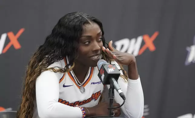 Phoenix Mercury guard-forward Kahleah Copper answers a quesion from the media during Mercury Media Day at the team's WNBA basketball training facility, Wednesday, April 30, 2025, in Phoenix. (AP Photo/Ross D. Franklin)