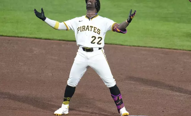 Pittsburgh Pirates' Andrew McCutchen celebrates on second base after hitting a double off Chicago Cubs pitcher Caleb Thielbar, driving in two runs, during the seventh inning of a baseball game in Pittsburgh, Sunday, April 6, 2025. (AP Photo/Gene J. Puskar)
