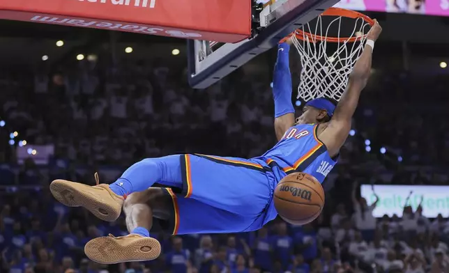 Oklahoma City Thunder guard Shai Gilgeous-Alexander (2) dunks during the second half of Game 5 of the Western Conference finals of the NBA basketball playoffs against the Minnesota Timberwolves, Wednesday, May 28, 2025, in Oklahoma City. (AP Photo/Nate Billings)