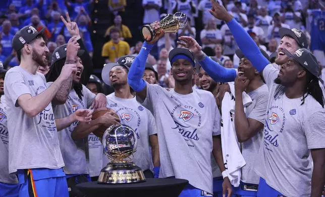 Oklahoma City Thunder guard Shai Gilgeous-Alexander (2), middle, celebrates with teammates after Game 5 of the Western Conference finals of the NBA basketball playoffs against the Minnesota Timberwolves, Wednesday, May 28, 2025, in Oklahoma City. (AP Photo/Nate Billings)