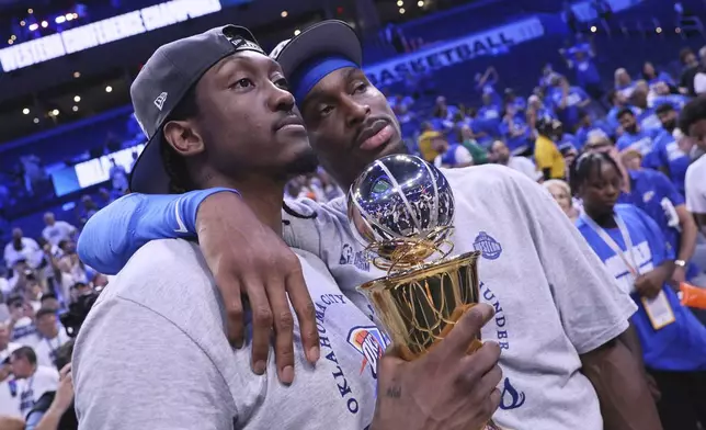 Oklahoma City Thunder forward Jalen Williams (8), left, and Oklahoma City Thunder guard Shai Gilgeous-Alexander (2) pose for a photo after Game 5 of the Western Conference finals of the NBA basketball playoffs against the Minnesota Timberwolves, Wednesday, May 28, 2025, in Oklahoma City. (AP Photo/Nate Billings)