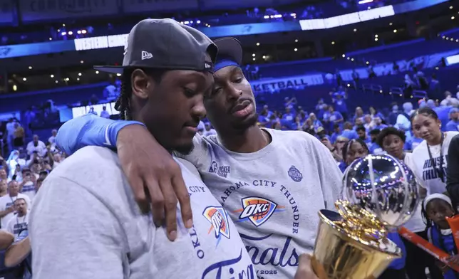 Oklahoma City Thunder forward Jalen Williams (8), left, and guard Shai Gilgeous-Alexander (2) stand on the court after Game 5 of the Western Conference finals of the NBA basketball playoffs against the Minnesota Timberwolves, Wednesday, May 28, 2025, in Oklahoma City. (AP Photo/Nate Billings)