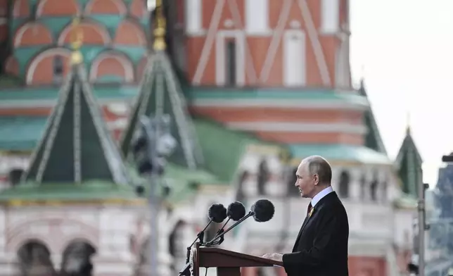 Russian President Vladimir Putin speaks during the Victory Day military parade in Moscow, Russia, Friday, May 9, 2025, during celebrations of the 80th anniversary of the Soviet Union's victory over Nazi Germany during the World War II. (Ilya Pitalev/Photo host agency RIA Novosti via AP)