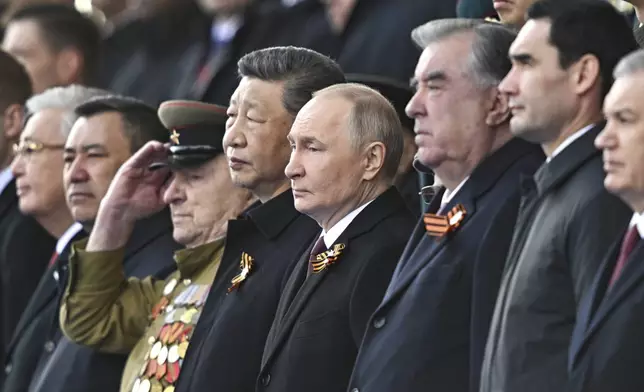 From second right: Turkmenistan President Serdar Berdimuhamedow, Tajikistan's President Emomali Rakhmon, Russian President Vladimir Putin and Chinese President Xi Jinpin watch the Victory Day military parade in Moscow, Russia, Friday, May 9, 2025, during celebrations of the 80th anniversary of the Soviet Union's victory over Nazi Germany during the World War II. (Sergei Bobylev/Photo host agency RIA Novosti via AP)