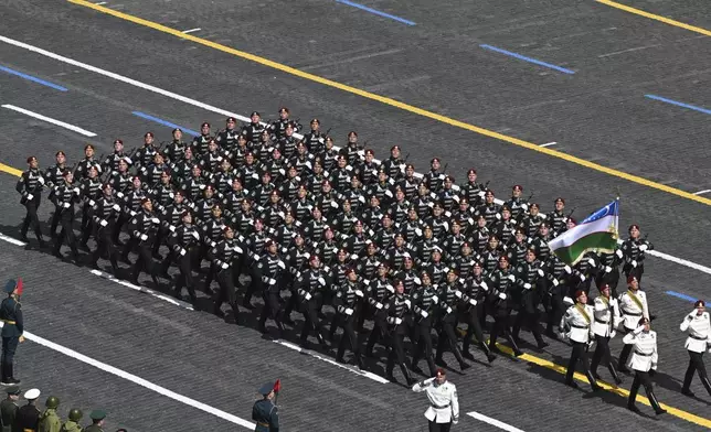 Uzbekistan's servicemen attend the Victory Day military parade in Moscow, Russia, Friday, May 9, 2025, during celebrations of the 80th anniversary of the Soviet Union's victory over Nazi Germany during the World War II. (Maxim Bogodvid/Photo host agency RIA Novosti via AP)