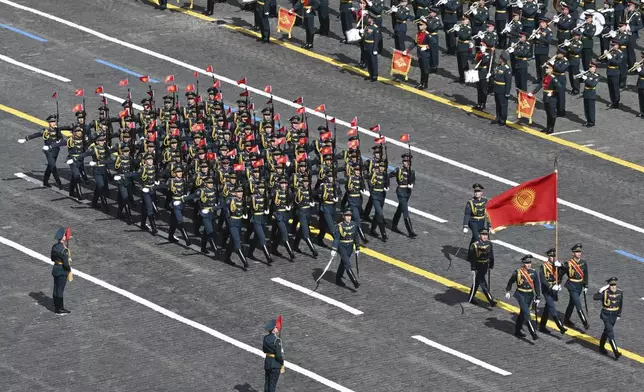 Kyrgyzstan's servicemen attend the Victory Day military parade in Moscow, Russia, Friday, May 9, 2025, during celebrations of the 80th anniversary of the Soviet Union's victory over Nazi Germany during the World War II. (Maxim Bogodvid/Photo host agency RIA Novosti via AP)