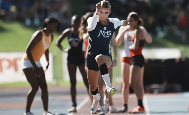 AB Hernandez warms up before competing in the long jump at the California high school track-and-field championships in Clovis, Calif., Friday, May 30, 2025. (AP Photo/Jae C. Hong)