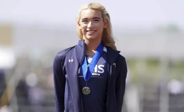 AB Hernandez of Jurupa Valley poses with a medal after winning the girls long jump during the CIF Southern Section Masters Meet at Moorpark High School, Saturday, May 24, 2025, in Moorpark, Calif. (Kirby Lee via AP)