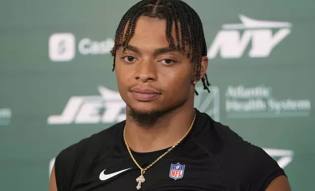 New York Jets quarterback Justin Fields talks to reporters after NFL football practice in Florham Park, N.J., Thursday, May 29, 2025. (AP Photo/Seth Wenig)