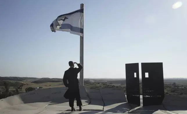 Ultra-orthodox Jewish man looks at the Gaza Strip from an observation point in Sderot, southern Israel, Monday, May 5, 2025. (AP Photo/Maya Alleruzzo)