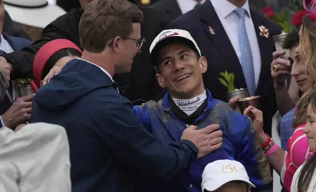 Junior Alvarado, right, celebrates after ridding Sovereignty to victory in the 151st running of the Kentucky Derby horse race at Churchill Downs Saturday, May 3, 2025, in Louisville, Ky. (AP Photo/Brynn Anderson)