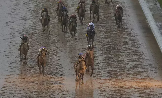 Sovereignty, ridden by Junior Alvarado, crosses the finish line to win the 151st running of the Kentucky Derby horse race at Churchill Downs Saturday, May 3, 2025, in Louisville, Ky. (AP Photo/Charlie Riedel)