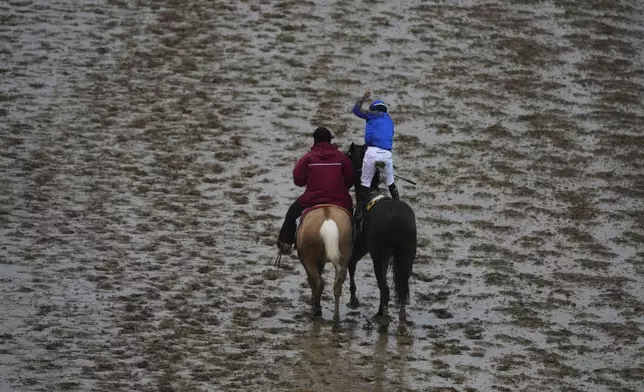 Junior Alvarado, celebrates after riding Sovereignty to victory in the 151st running of the Kentucky Derby horse race at Churchill Downs Saturday, May 3, 2025, in Louisville, Ky. (AP Photo/Charlie Riedel)