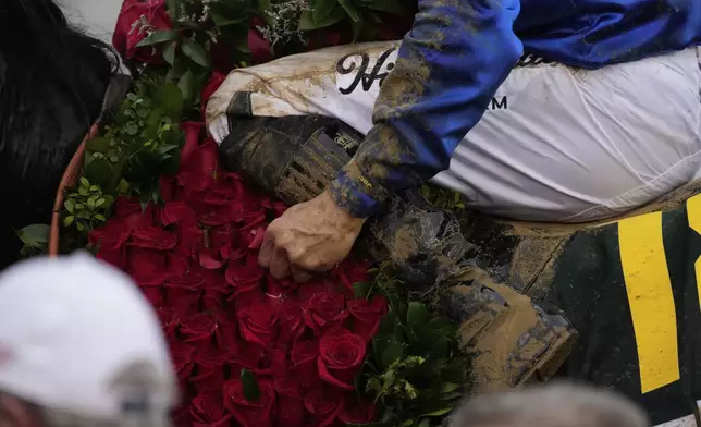 Sovereignty, ridden by Junior Alvarado, celebrates in the winners circle after winning the 151st running of the Kentucky Derby horse race at Churchill Downs Saturday, May 3, 2025, in Louisville, Ky. (AP Photo/Brynn Anderson)