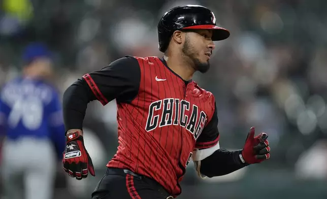Chicago White Sox's Lenyn Sosa runs the bases after hitting a single during the sixth inning of a baseball game against the Texas Rangers, Friday, May 23, 2025, in Chicago. (AP Photo/Erin Hooley)