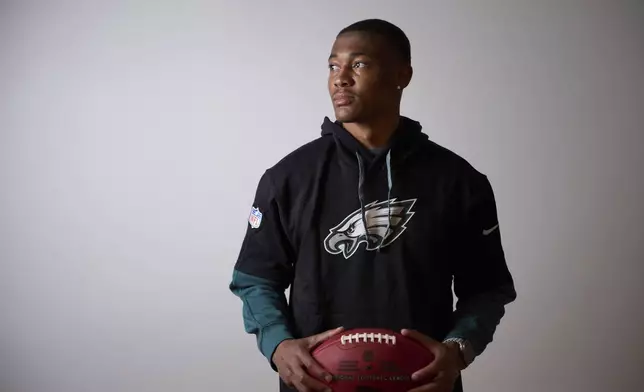 Philadelphia Eagles DeVonta Smith holds the ball as he poses for a photo ahead of an interview with the Associated Press in Barcelona, Spain, Monday, May 12, 2025. (AP Photo/Emilio Morenatti)