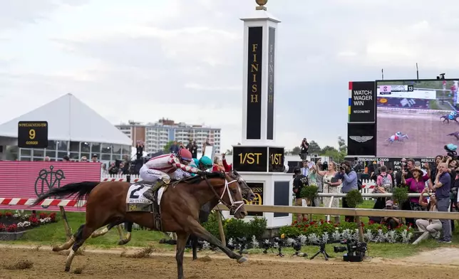 Umberto Rispoli, atop Journalism, left, edges out Luis Saez, atop Gosger, to win the 150th running of the Preakness Stakes horse race Saturday, May 17, 2025, at Pimlico Race Course in Baltimore. (AP Photo/Julia Demaree Nikhinson)