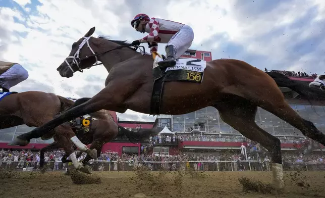 Umberto Rispoli, atop Journalism, participates in the 150th running of the Preakness Stakes horse race Saturday, May 17, 2025, at Pimlico Race Course in Baltimore. (AP Photo/Stephanie Scarbrough)