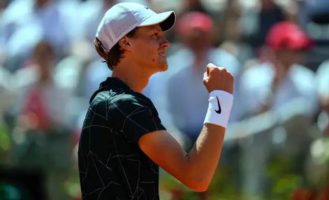 FILE - Italy's Jannik Sinner celebrates after winning a point to Greece's Stefanos Tsitsipas during their match at the Italian Open tennis tournament, in Rome, May 13, 2022. (AP Photo/Alessandra Tarantino, File)