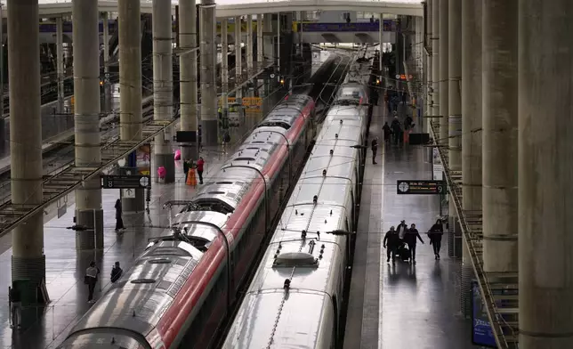 Trains are photographed on their platforms at the Madrid train station, Spain, Monday, May 5, 2025. (AP Photo/Manu Fernandez)