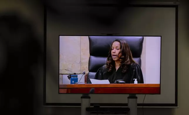Judge Christina Mims instructs a deadlocked jury as they deliberate a verdict for former Grand Rapids Police officer Christopher Schurr, who is charged with second-degree murder in the fatal shooting of Patrick Lyoya, a 26-year-old Congolese immigrant, at the Kent County Courthouse in Grand Rapids, Mich., Tuesday, May 6, 2025. (Joel Bissell /MLive.com/Kalamazoo Gazette via AP)