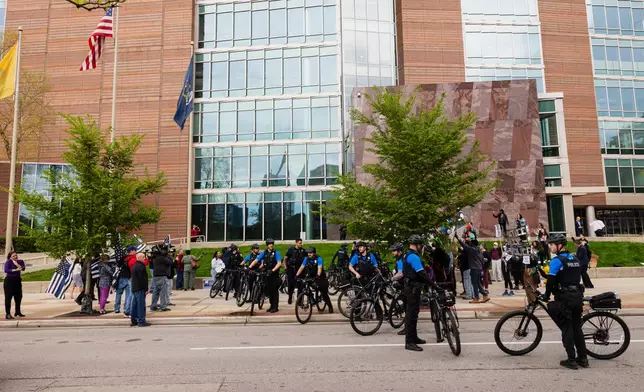 Police use bicycles to divide supporters of former Grand Rapids police officer Christopher Schurr, who is charged with second-degree murder in the fatal shooting of Patrick Lyoya, a Congolese immigrant, and Lyoya outside the Kent County Courthouse in Grand Rapids, Mich., Tuesday, May 6, 2025. (Joel Bissell/MLive.com/Kalamazoo Gazette via AP)
