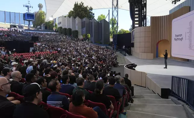 Alphabet CEO Sundar Pichai, right, speaks at a Google I/O event in Mountain View, Calif., Tuesday, May 20, 2025. (AP Photo/Jeff Chiu)