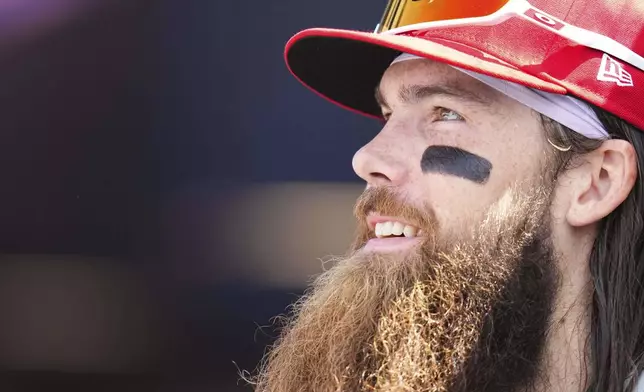 Philadelphia Phillies' Brandon Marsh looks on from the dugout during the eighth inning of a baseball game against the Colorado Rockies, Thursday, May 22, 2025, in Denver. (AP Photo/Jack Dempsey)