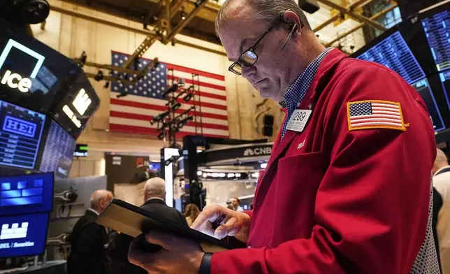 Trader William Lawrence works on the floor of the New York Stock Exchange, Wednesday, May 14, 2025. (AP Photo/Richard Drew)