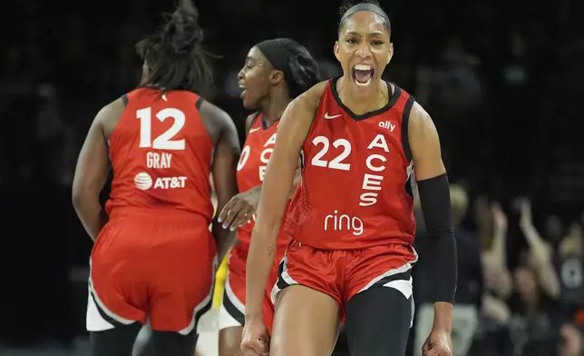 Las Vegas Aces center A'ja Wilson (22) celebrates after a play against the Los Angeles Sparks during the first half of a WNBA basketball game Friday, May 30, 2025, in Las Vegas. (AP Photo/John Locher)