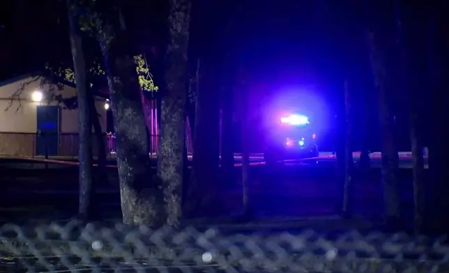 This image made from a video provided by KOMO shows a police vehicle at Harry Todd Park in Lakewood, Wash., Wednesday, May 28, 2025. (KOMONEWS.COM via AP)