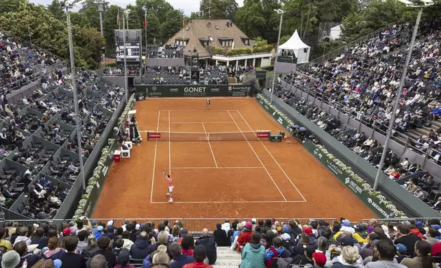 Serbia's Novak Djokovic returns a ball to Hungary's Marton Fucsovics during the round of 16 match at the ATP 250 Geneva Open Tennis Tournament, in Geneva, Switzerland, Wednesday, May 21, 2025 (Cyril Zingaro/Keystone via AP)