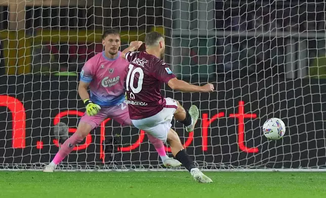 Torino's Nikola Vlasic scores from the penalty spot during the Serie A soccer match between FC Torino and Venezia at the Olympic Stadium in Turin, Italy, Friday, May 2, 2025. (Spada/LaPresse via AP)