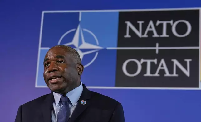 British Foreign Secretary David Lammy talks to journalists as he arrives for a NATO's informal meeting of foreign ministers in Antalya, southern Turkey, Thursday, May 15, 2025. (AP Photo/Khalil Hamra)