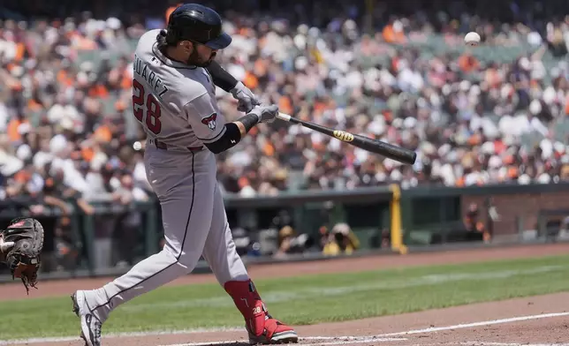 Arizona Diamondbacks' Eugenio Suárez hits a three-run home run against the San Francisco Giants during the third inning of a baseball game in San Francisco, Wednesday, May 14, 2025. (AP Photo/Jeff Chiu)