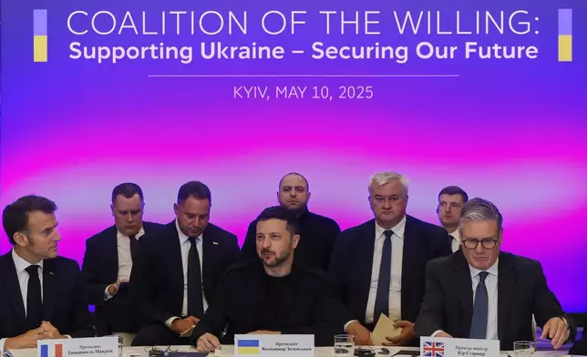 France's President Emmanuel Macron, left, Ukrainian President Volodymyr Zelenskyy and British Prime Minister Keir Starmer, right, sit during a summit at the Mariinskyi Palace, in Kyiv, Ukraine, Saturday, May 10, 2025. (Ludovic Marin, Pool Photo via AP)