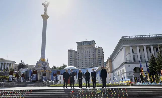 From left, Poland's Prime Minister Donald Tusk, , Britain's Prime Minister Keir Starmer, Olena Zelenska, Ukraine's President Volodymyr Zelensky, France's President Emmanuel Macron, and Germany's Chancellor Friedrich Merz pose for a picture at the Independence Square in Kyiv, Ukraine, Saturday, May 10, 2025. (Ludovic Marin, Pool Photo via AP)