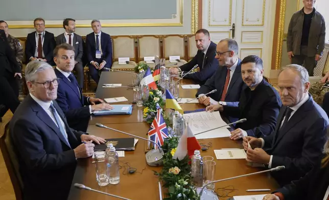 Britain's Prime Minister Keir Starmer, left, France's President Emmanuel Macron, 2nd left, Poland's Prime Minister Donald Tusk, right, Ukraine's President Volodymyr Zelensky, 2nd right, and Germany's Chancellor Friedrich Merz, 3rd right, meet at the Mariinskyi Palace, in Kyiv, Ukraine, Saturday, May 10, 2025. (Ludovic Marin, Pool Photo via AP)