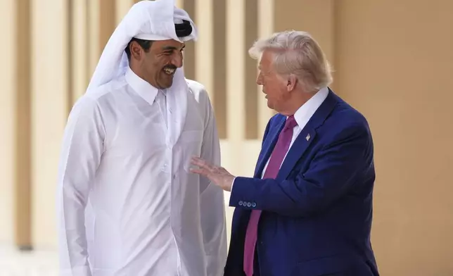President Donald Trump and Qatar's Emir Sheikh Tamim bin Hamad Al Thani speak at Al Udeid Air Base, Thursday, May 15, 2025, in Doha, Qatar. (AP Photo/Alex Brandon)